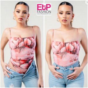 pink women's bodysuit with straps and prints